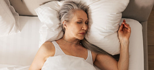 Older woman sleeping peacefully on bed