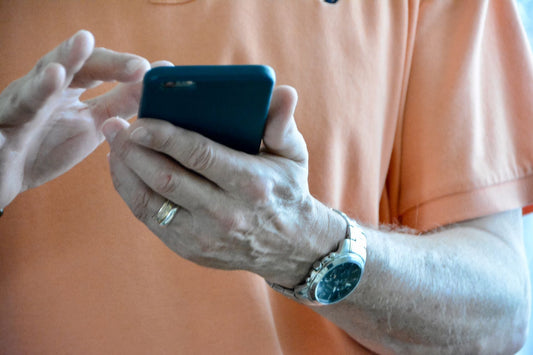 senior man on cellphone causing hypertension