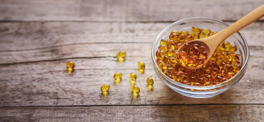 cbd softgels for seniors in bowl on wooden background