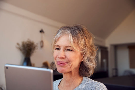 Senior woman focused on digital tablet